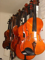 Violins and violas hang in Rakić shop in Novi Sad