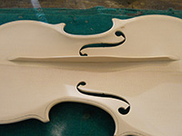 Violin top plate with bass bar in the making